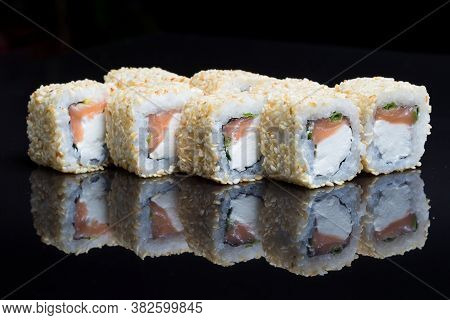 Sushi Rolls Shake Chizu With Sesame On A Black Background.