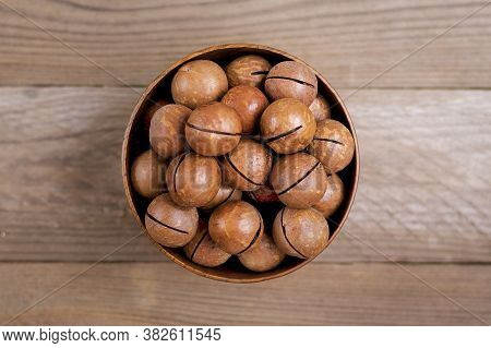 Natural Organic Macadamia Nuts In Bowl On Wooden Table Flat Lay Top View Healthy Snack Nuts Contain 