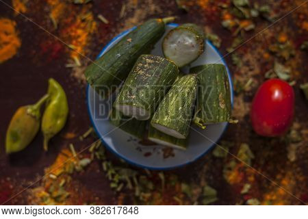 Close Up Shot Of Raw Galka Or Sponge Gourd Cut In A Glass Plate Along With All The Spices Including 