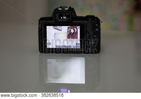 Frankfurt, Germany - 26th August 2020: A German Photographer Prepares His Old Canon Eos M50 With The