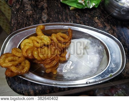 Fresh And Crispy Sweet Dish Of West India- Jalebi. Delicious Street Side Snack Popular In Black And 