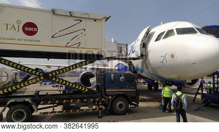 Mumbai, Maharastra/india- April 07 2020: The Cargo Is Loaded On The Passenger Airplane By A Crane Tr