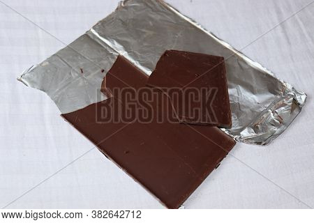An Unpacked Piece Of Single Origin Dark Chocolate Sold In The Market.