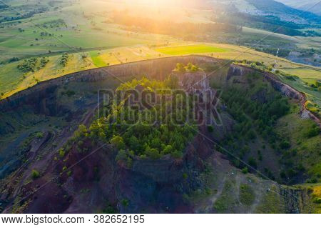 Aerial view of  Racos volcanic crater in the sunrise, Brasov county, Romania 