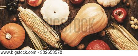Thanksgiving Background, Food Autumn Harvest Concept. Rustic Table With Apples, Pumpkins, Nuts, Grap
