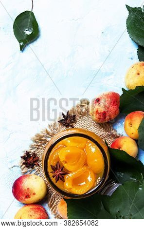 Apricot Jam With Anise Stars And Fresh Apricots With Leaves, Top View