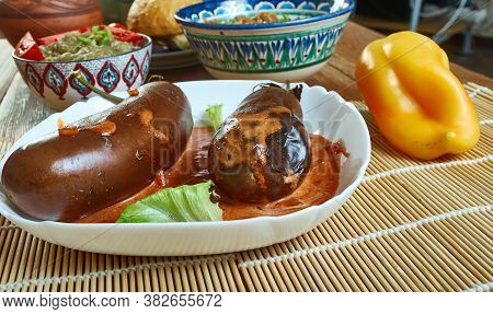Kashmiri Khatte Baingan, Vegetable Curry Made Using Aubergine, Tamarind, Ginger And Chilli.