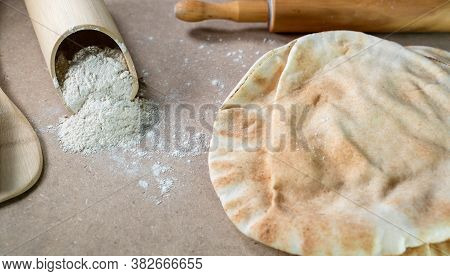 Kuboos Or Khubz - Arabic Bread On A Brown Table In The Kitchen