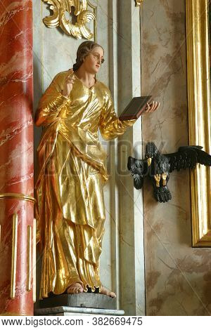 PLESIVICA, CROATIA - JULY 22, 2013: Saint John the Evangelist, high altar statue at Saint George Parish Church in Plesivica, Croatia