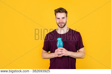 Helps Metabilize Food. Drinking Water. Handsome Young Man With Fit Body Drinking Fresh Water. Thirst