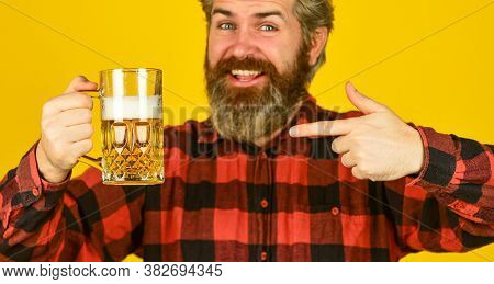 Strong Drink In Supermarket. Beer With Foam. Brutal Hipster Drink Beer. Mature Bearded Barman Hold B