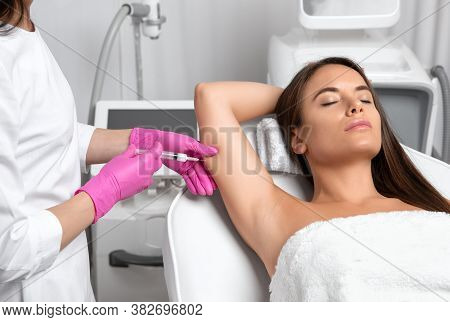 Aesthetic Cosmetologist Makes Lipolytic Injections To Burn Fat On The Arm And Body Of A Woman. Femal