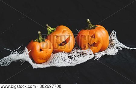 Halloween, Jack's Heads Made Of Yellow Bell Pepper On A Black Background. Close-up, Selective Focus.