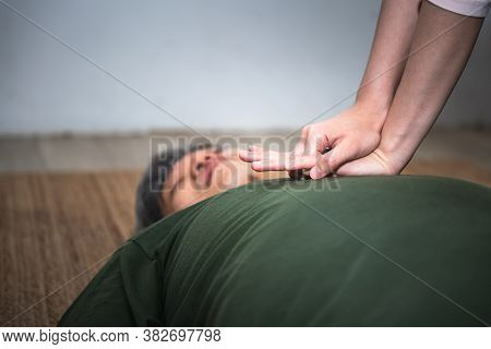 Close Up Hand Of People  Are Doing First Aid By Cardiopulmonary Resuscitation Or Cpr To Elderly Fat 