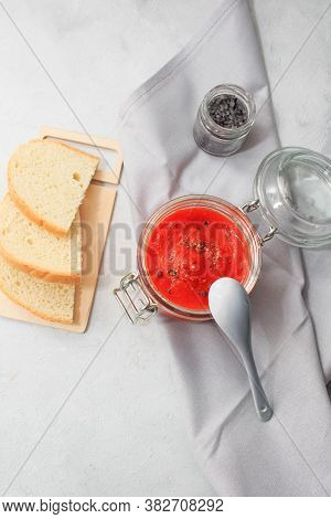 Ajvar, Pepper Mousse In A Jar And On  Bread And Gray Spoon On Backgground. Ajvar - Delicious Dish Of