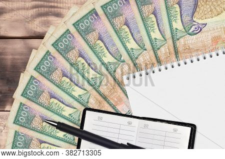 1000 Sri Lankan Rupees Bills Fan And Notepad With Contact Book And Black Pen. Concept Of Financial P