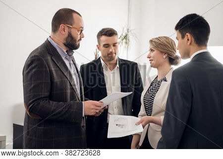 The Chief Of The Construction Company Holds A Standing Meeting With Subordinates, Gives Instructions