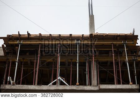 Urban Construction Site On The Future Spot For A Residential Tower Of Apartments Buildings With Scaf