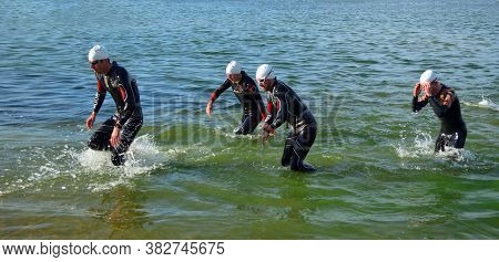Grafham, Cambridgeshire, England - August 06, 2017:  Leading Competitors  Leaving The Water At The E