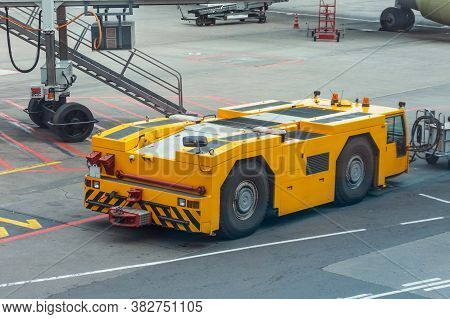Tow Truck Vehicles Trailer For Puch Back Plane At The Airfield