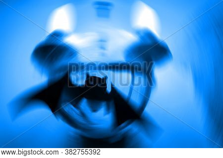 Silhouette Of A Mystical Bat On A Twilight Blue Background With A Radial Blur. Close Up