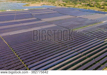Aerial View Of The Solar Panel In Solar Farm For Green Energy