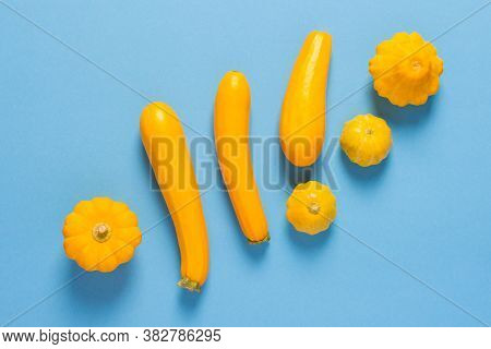 Fresh Harvest Of Zucchini And Pattypan Squash, Yellow Squash And Pattison On Blue Background