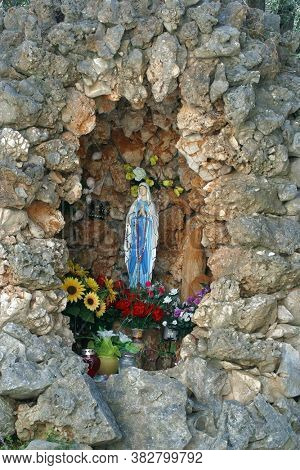 LUN, CROATIA - AUGUST 17, 2013: Our Lady of Lourdes, St. Jerome parish church in Lun, Croatia