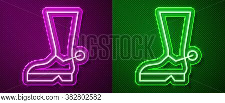 Glowing Neon Line Cowboy Boot Icon Isolated On Purple And Green Background. Vector Illustration