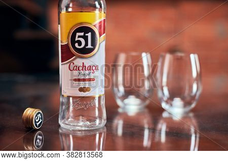 Moscow - 23.11.2019 - Cachaca 51 Bottle With Two Glasses. Brazilian Rum. Exotic Brazil Strong Alcoho