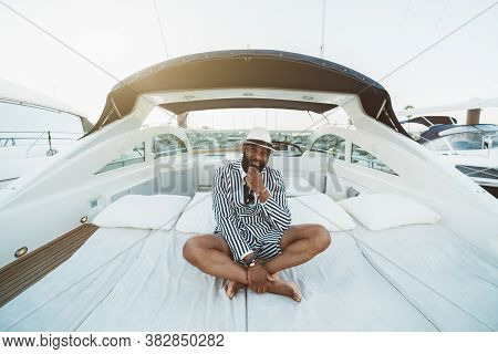 A Cheerful Wealthy Bearded Mature Black Guy In An Elegant Striped Black And White Costume With Short