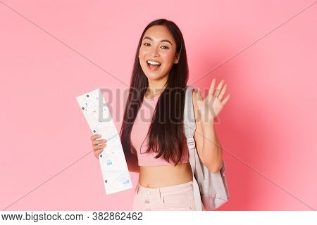 Travelling, Lifestyle And Tourism Concept. Cheerful Beautiful Asian Girl In Summer Clothes And Backp