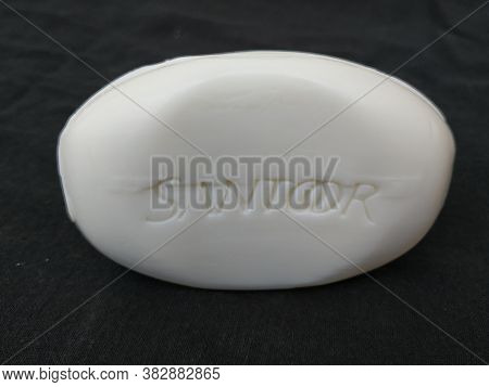 Closeup Of Pack Opened And Closed White Color Santoor Sandal And Almond Milk Soap Bar Isolated On Bl