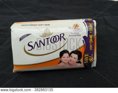 Closeup Of Pack Opened And Closed White Color Santoor Sandal And Almond Milk Soap Bar Isolated On Bl