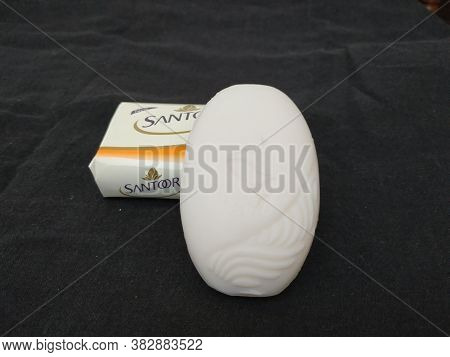 Closeup Of Pack Opened And Closed White Color Santoor Sandal And Almond Milk Soap Bar Isolated On Bl