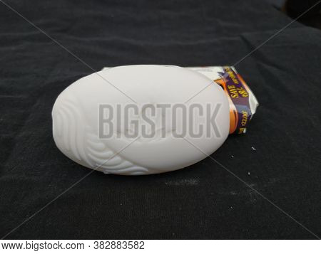 Closeup Of Pack Opened And Closed White Color Santoor Sandal And Almond Milk Soap Bar Isolated On Bl