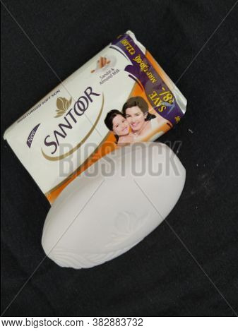Closeup Of Pack Opened And Closed White Color Santoor Sandal And Almond Milk Soap Bar Isolated On Bl