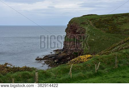 Fantastic Red Rock Sea Cliffs Along The Coast Of St Bees.