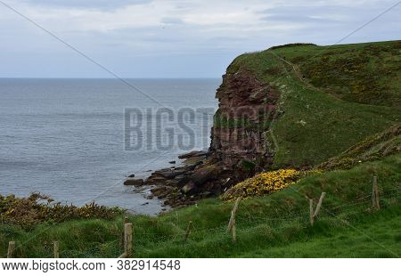Gorgeous Towering Red Sea Cliffs In St Bees England.