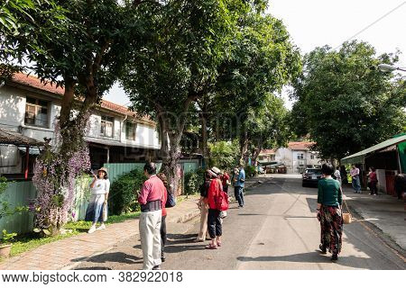 Nantou, Taiwan - April 9th, 2020: dendrobium flowers at street with tourists in Zhongxing new village, Nantou, Taiwan, Asian