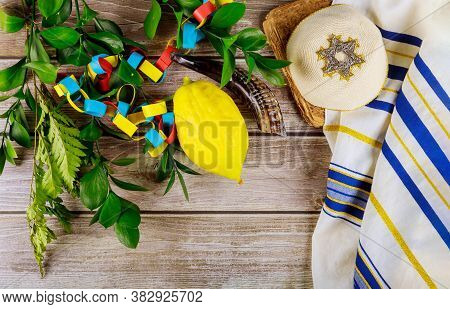 Jewish Festival Of Sukkoth Over Paper Colorful Chain Garland On Species Lulav Kippah