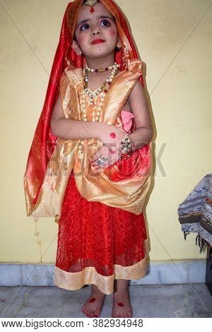 Cute Indian Kid Dressed Up As Little Lord Radha On The Occasion Of Radha Krishna Janmastami Festival