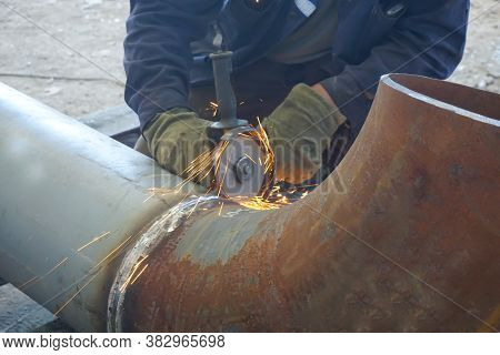 Weld Seam Cleaning. Manual Arc Welding Of Technological Pipelines And Metal Structures For An Oil Re