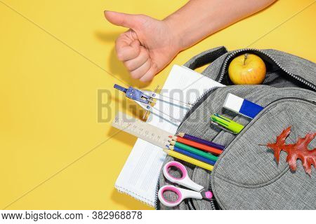 Hand With Super Gesture, School Backpack With Compasses, Ruler, Eraser, Pencils, Pen, Scissors, Autu