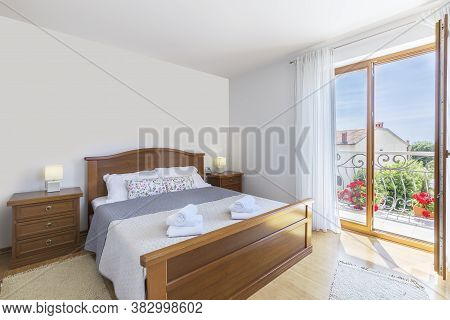 Inetrior Detail Of Modern Bedroom And Balcony View
