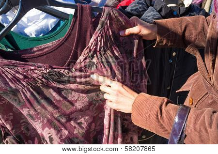 Rummaging On A Clothes Stall