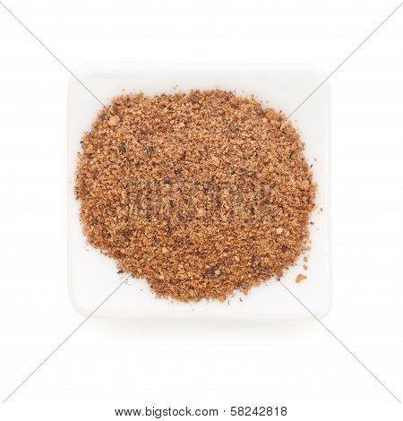 Nutmeg Powder (myristica Fragrans) In A White Bowl On White Background.