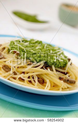 Italian pasta with pesto sauce.