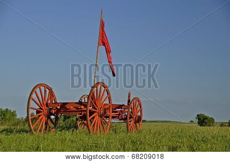 Red flag along side of horse drawn wagon at Fort Sisseton, SD