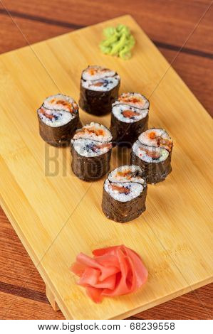 Japanese cuisine - sushi rolls with tobico and pancake